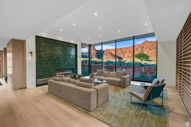 973 W Sipala Trl, Ivins, UT 84738 - living room featuring a mountain view, floor to ceiling windows, and light wood-type flooring