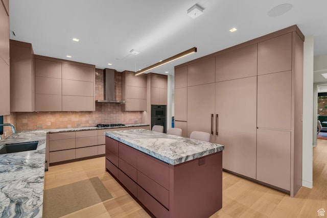 973 W Sipala Trl, Ivins, UT 84738 - kitchen featuring decorative backsplash, wall chimney exhaust hood, sink, light hardwood / wood-style flooring, and a large island