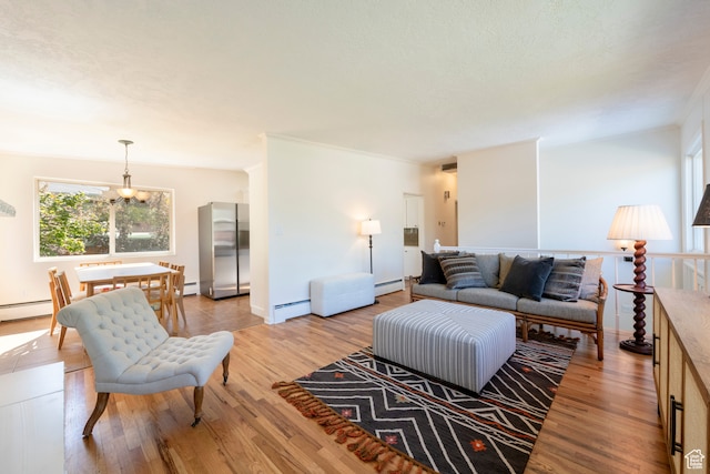 living room featuring light wood-type flooring, a baseboard radiator, and an inviting chandelier