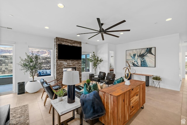 3617 S Cypress Point Rd, Hurricane, UT 84737 - living room with ceiling fan, a fireplace, and light tile patterned floors