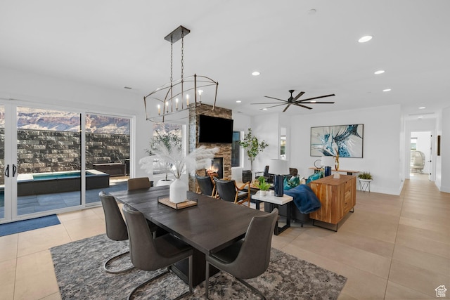 3617 S Cypress Point Rd, Hurricane, UT 84737 - tiled dining area featuring plenty of natural light and a stone fireplace