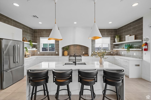 3617 S Cypress Point Rd, Hurricane, UT 84737 - kitchen with white cabinetry, high end refrigerator, sink, and light tile patterned floors