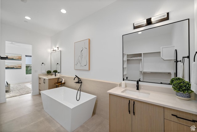 3617 S Cypress Point Rd, Hurricane, UT 84737 - bathroom featuring vanity, tile walls, and a washtub