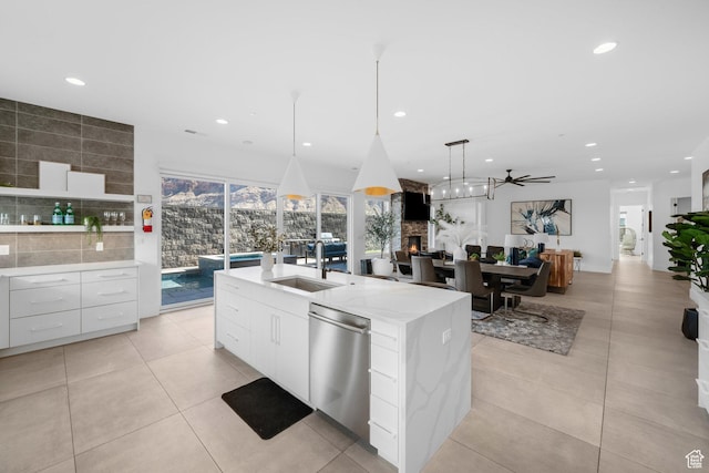 3617 S Cypress Point Rd, Hurricane, UT 84737 - kitchen featuring pendant lighting, dishwasher, white cabinetry, sink, and a kitchen island with sink