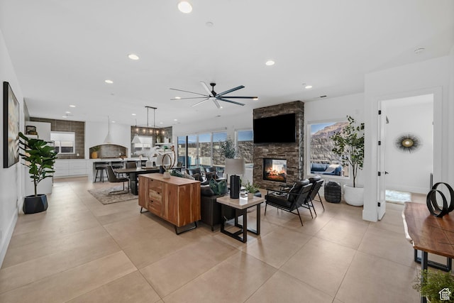 3617 S Cypress Point Rd, Hurricane, UT 84737 - tiled living room featuring a stone fireplace