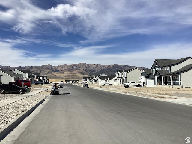 796 W Cherry Orchard Ln S, Grantsville, UT 84029 - view of street with sidewalks, curbs, a mountain view, and a residential view