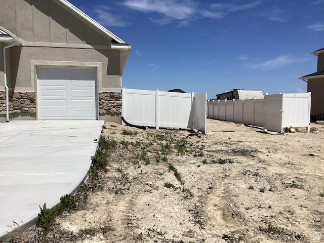 796 W Cherry Orchard Ln S, Grantsville, UT 84029 - view of yard with concrete driveway and a garage