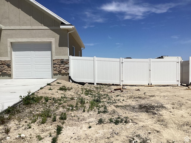 796 W Cherry Orchard Ln S, Grantsville, UT 84029 - view of yard with a gate, driveway, and a garage