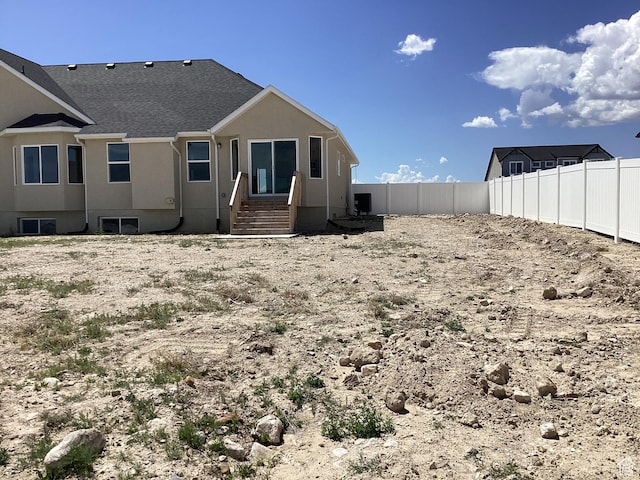 796 W Cherry Orchard Ln S, Grantsville, UT 84029 - rear view of property featuring a fenced backyard and stucco siding