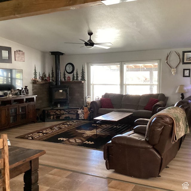 1528 E Valley View Dr, Manila, UT 84046 - living room featuring vaulted ceiling, a wood stove, ceiling fan, and wood finished floors