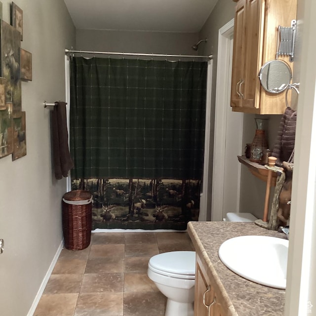 1528 E Valley View Dr, Manila, UT 84046 - bathroom with vanity, toilet, baseboards, and a tile shower