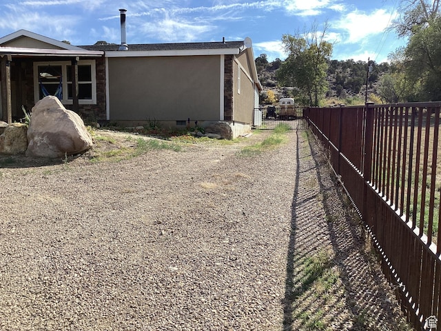 1528 E Valley View Dr, Manila, UT 84046 - view of side of home featuring a fenced backyard and crawl space