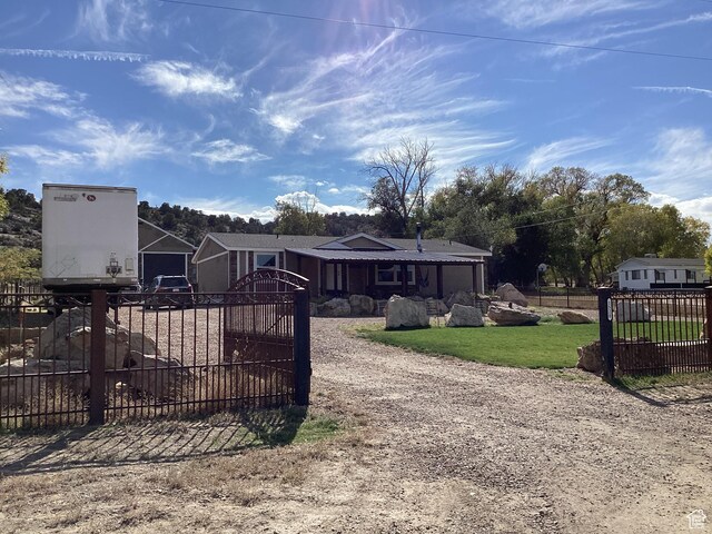 1528 E Valley View Dr, Manila, UT 84046 - view of front of property with a gate, fence, dirt driveway, and a front yard