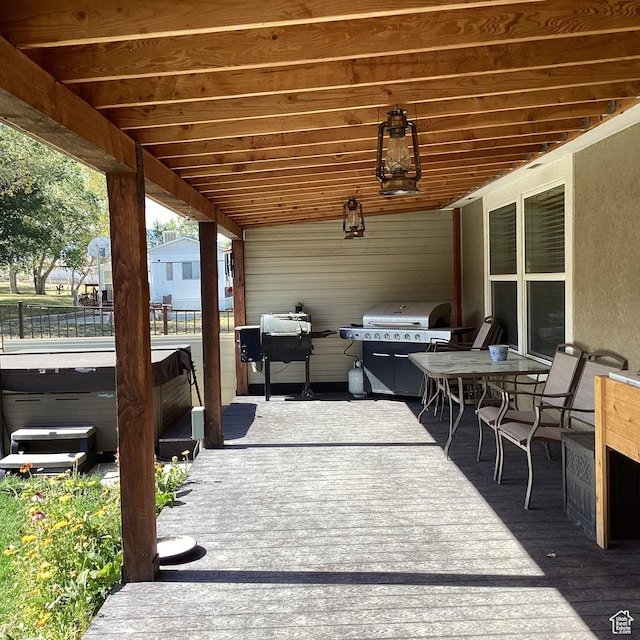 1528 E Valley View Dr, Manila, UT 84046 - view of patio featuring a hot tub, fence, and area for grilling