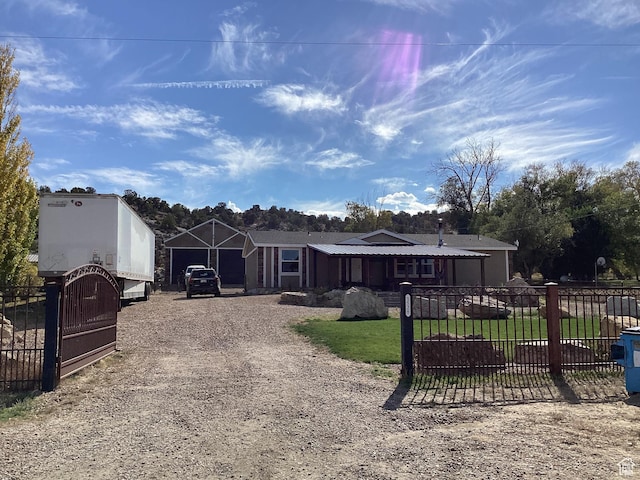1528 E Valley View Dr, Manila, UT 84046 - view of front of home with driveway, a gate, and fence private yard