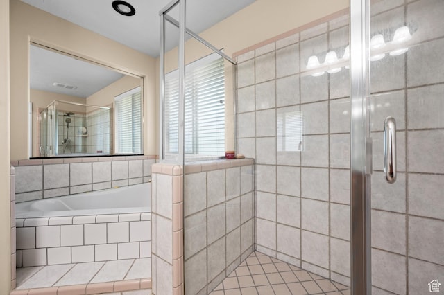 full bath featuring a shower stall, a garden tub, and visible vents