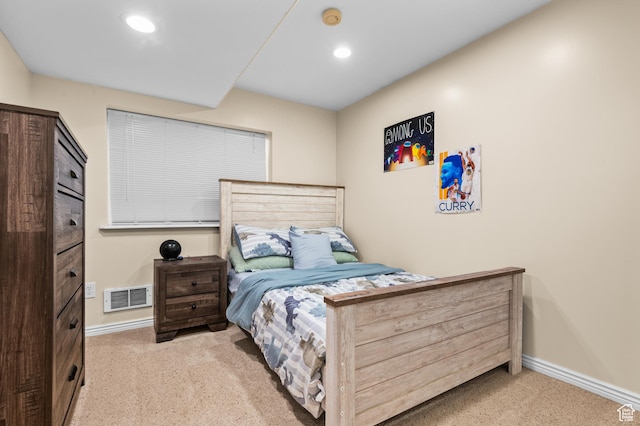 bedroom featuring visible vents, baseboards, and carpet floors