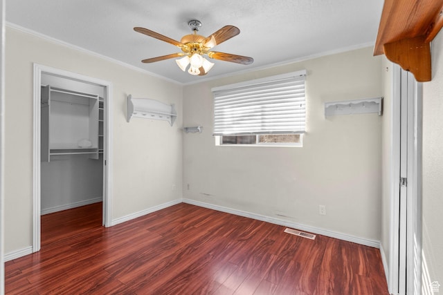 53 Pioneer Way, Hurricane, UT 84737 - unfurnished bedroom with a spacious closet, wood finished floors, a closet, crown molding, and ceiling fan