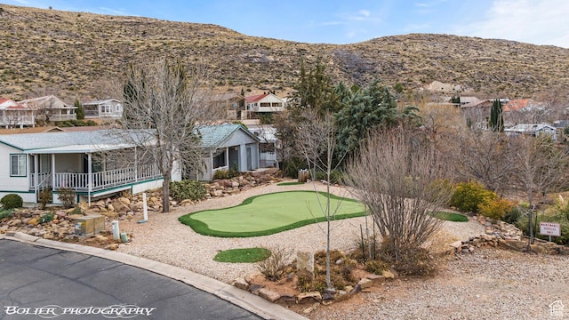 53 Pioneer Way, Hurricane, UT 84737 - view of front facade featuring a putting area, a mountain view, and a residential view
