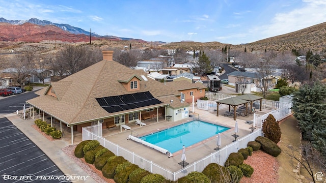 53 Pioneer Way, Hurricane, UT 84737 - community pool featuring a fenced backyard, a mountain view, a patio area, and a residential view