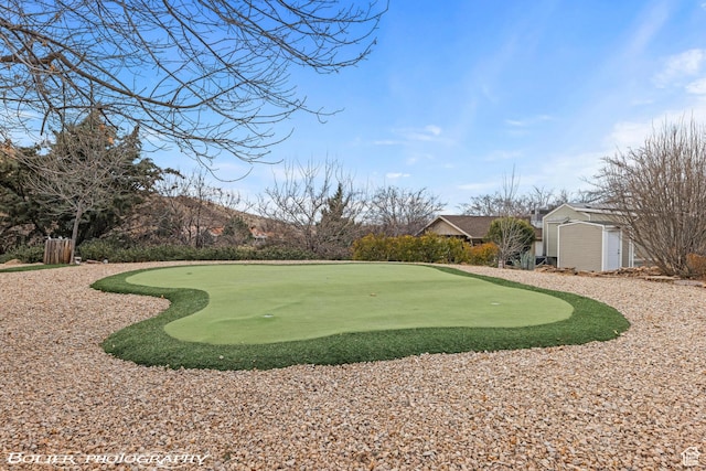 53 Pioneer Way, Hurricane, UT 84737 - view of property's community with an area to practice putting, a storage unit, and view of golf course
