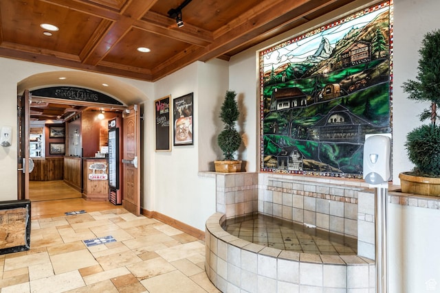 corridor with baseboards, wooden ceiling, beam ceiling, recessed lighting, and coffered ceiling