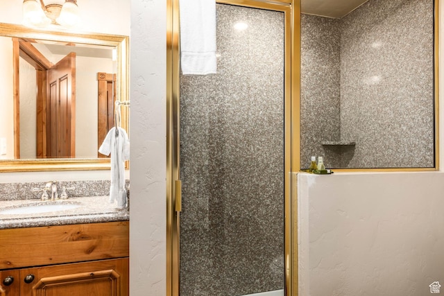 full bathroom featuring a shower stall and vanity