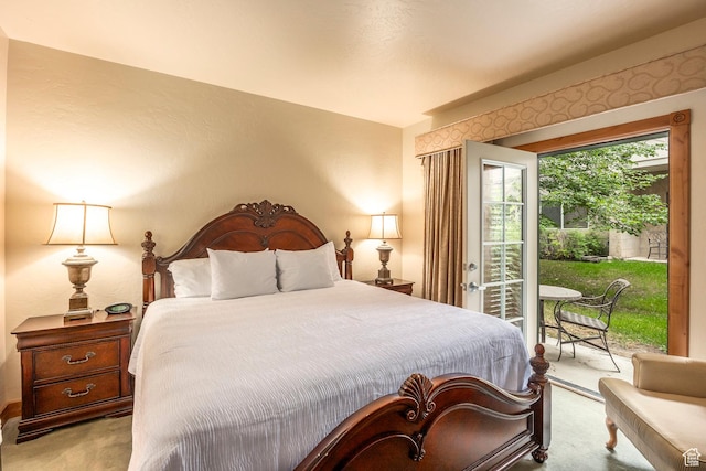 carpeted bedroom with access to outside