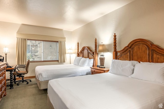 carpeted bedroom with baseboards