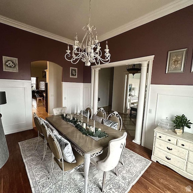 1350 E 600 S, Richfield, UT 84701 - dining space featuring a chandelier, arched walkways, ornamental molding, and wainscoting