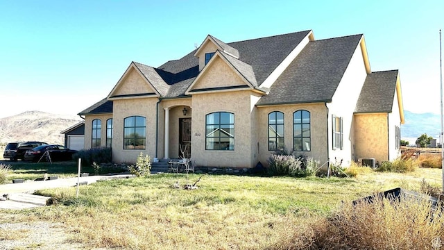 1350 E 600 S, Richfield, UT 84701 - view of front of house featuring roof with shingles, a mountain view, stucco siding, and a garage