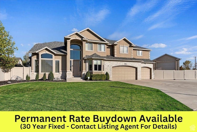 view of front of property featuring a garage and a front yard