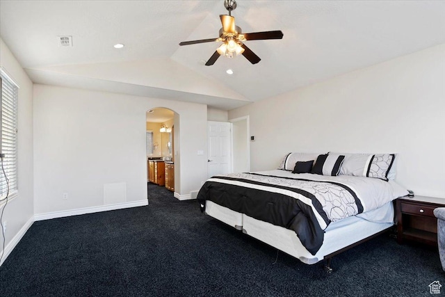 bedroom with lofted ceiling, dark carpet, visible vents, baseboards, and arched walkways
