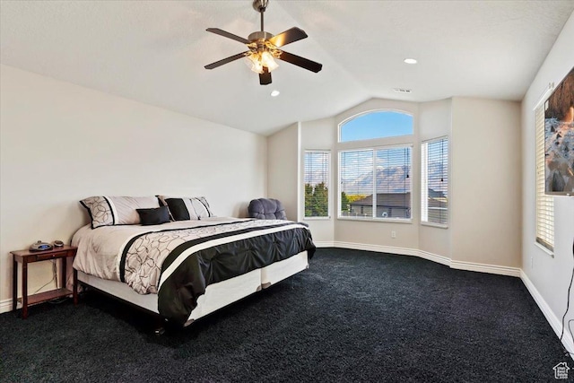 bedroom with dark colored carpet, multiple windows, lofted ceiling, and baseboards