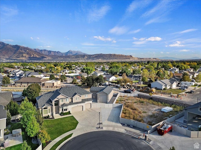 drone / aerial view featuring a mountain view and a residential view
