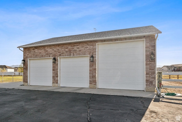 garage featuring fence
