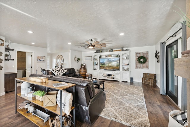 living area featuring recessed lighting, wood finished floors, ceiling fan, baseboards, and a textured ceiling