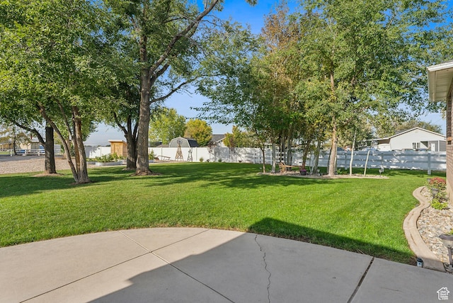view of yard with a patio area and fence