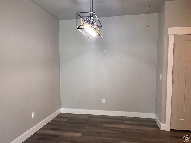 6916 N 2750 W, Honeyville, UT 84314 - unfurnished dining area featuring baseboards and dark wood-style flooring