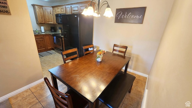 2511 Redcliff Rd Unit 1-E, Moab, UT 84532 - dining area with baseboards, an inviting chandelier, and light tile patterned flooring