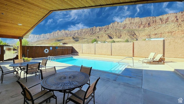 3448 Tierra Del Sol Dr, Moab, UT 84532 - view of swimming pool featuring a fenced backyard, a fenced in pool, and a patio