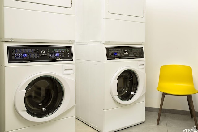 2670 Canyons Resort Dr Unit 208, Park City, UT 84098 - laundry area featuring stacked washing machine and dryer, light tile patterned floors, and baseboards
