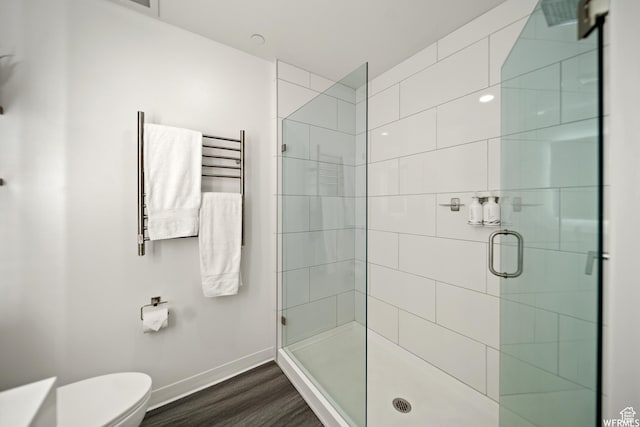 2670 Canyons Resort Dr Unit 208, Park City, UT 84098 - bathroom with a stall shower, toilet, baseboards, wood finished floors, and a towel warmer