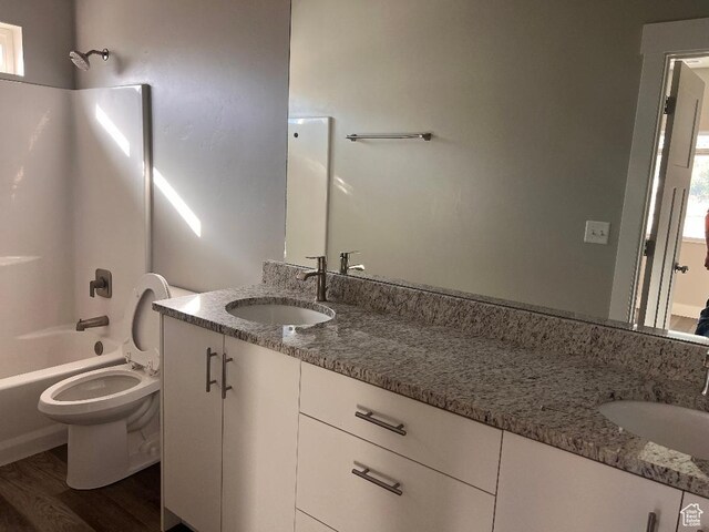 6932 N 2750 W, Honeyville, UT 84314 - full bath featuring wood finished floors, vanity, tub / shower combination, and toilet
