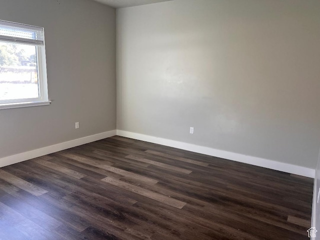 6932 N 2750 W, Honeyville, UT 84314 - empty room featuring baseboards and dark wood-style flooring