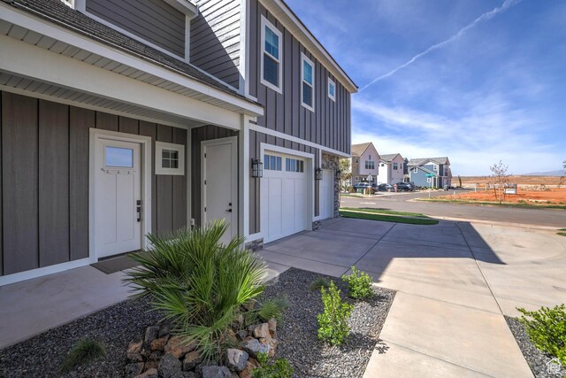 4971 S Cattail Way, Washington, UT 84780 - entrance to property with board and batten siding, a residential view, and a garage