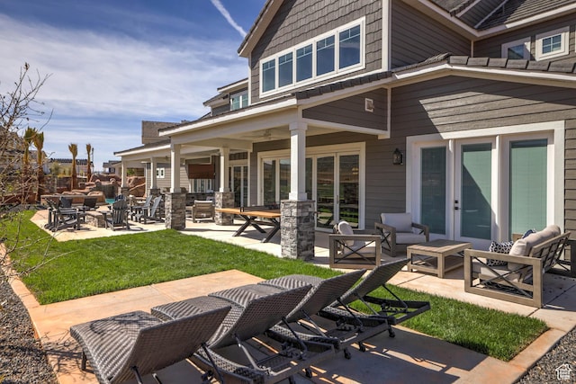 4971 S Cattail Way, Washington, UT 84780 - back of house with a patio area and a lawn