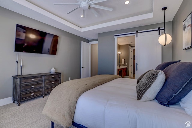 4971 S Cattail Way, Washington, UT 84780 - bedroom with ensuite bath, a barn door, light carpet, a raised ceiling, and baseboards