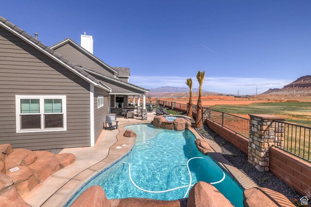 4971 S Cattail Way, Washington, UT 84780 - view of swimming pool with a mountain view, a fenced backyard, a fenced in pool, and a patio