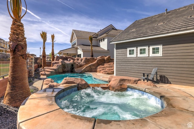 4971 S Cattail Way, Washington, UT 84780 - view of swimming pool featuring a fenced backyard, a water slide, and an in ground hot tub